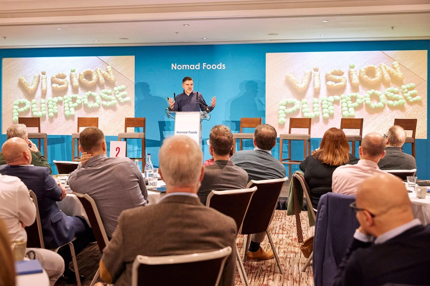 Delegates watching a Vision & Purpose presentation at the conference